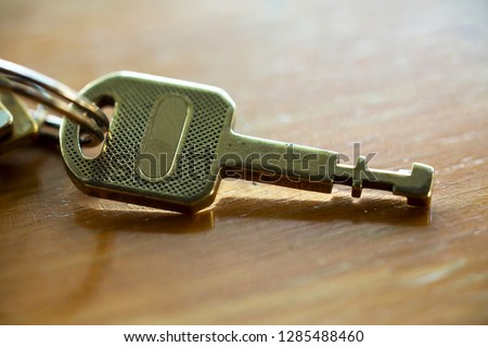 A key on the wooden table, Close up & Macro shot, Selective focus