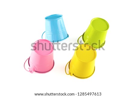 Four small colorful buckets. Isolated on white background.
