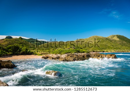 Bay with beach in Puerto Plata Dominican Republic with ocean waves Royalty-Free Stock Photo #1285512673