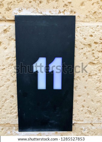 Number 11 on the front of the house, close up