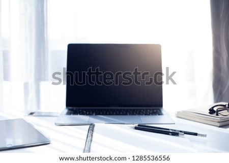 Desk Workplace with laptop  on white table ,Tools used for design ,notebook and tablet