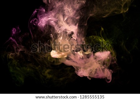 Yellow and pink  cloud smoke on black  isolated background