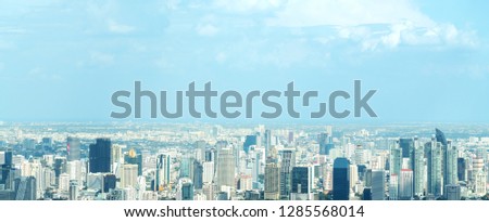 Banner of Aerial view cityscape of modern city in Bangkok. Urban landscape of Center business of thailand in Panoramic view. City and Building skyscapers with blue sky.