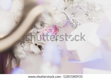 snow covered wedding bouquet on table, decorations, sparkles, snowflakes, close up