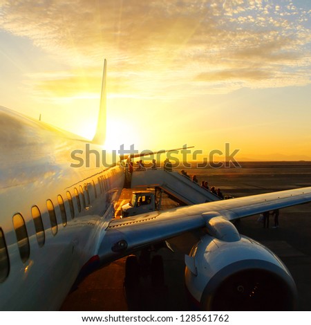 aircraft in airport at sunset Royalty-Free Stock Photo #128561762