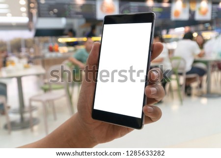 Man holding smartphone with blank screen.Blank screen mobile phone for graphic display montage.empty copy space for advertising