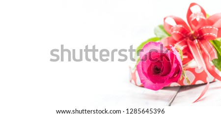 Red rose and present for Valentine and Sweetest day. Gift witrh love isolated on white background Royalty-Free Stock Photo #1285645396