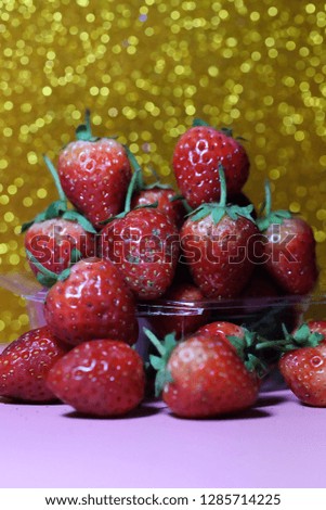 Strawberry on glitter gold background and have space for write wording, sweet romantic fruit for special person, lovers in Valentine day, make many dessert menu or juice or dairy strawberry flavor