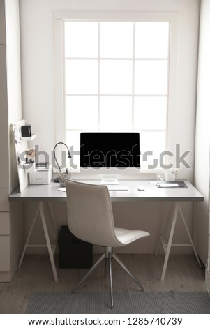 Light work place with computer near window. Interior design