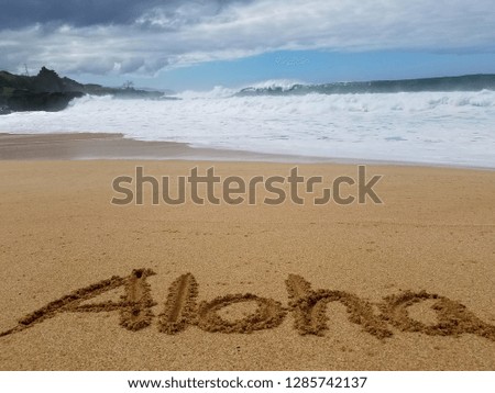 View of beautiful beach in North Shore,Hawaii with Aloha word on sand. 