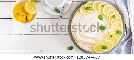 Tart with lemon curd  and meringue. Lemon  pie. American cuisine. Dessert. Banner. Top view
