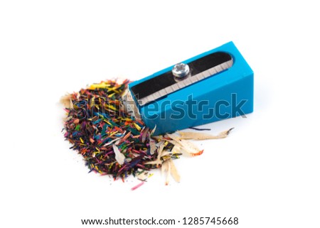 Pencil sharpener and wood shavings isolated on white - Image