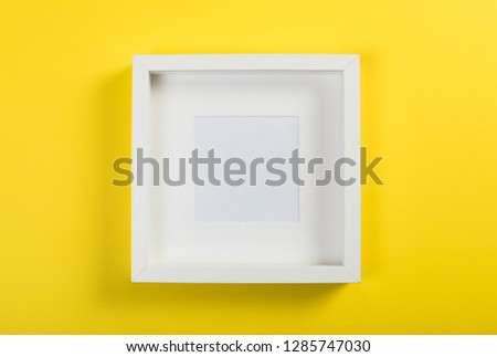 white frame on yellow background