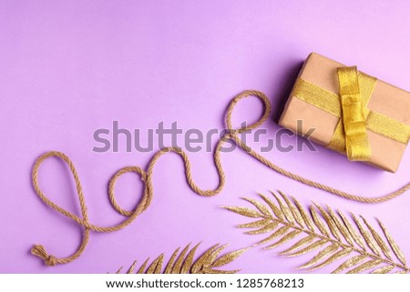 Beautiful gift box and decor on color background