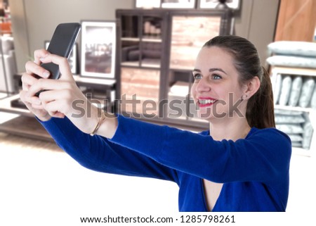 beautiful woman using smart phone in home selfie