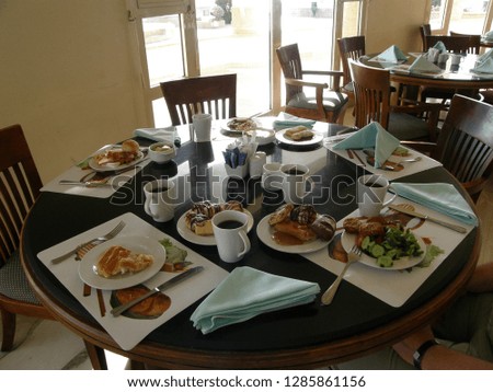 Table with Breakfast for four persons Royalty-Free Stock Photo #1285861156