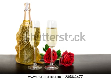 Champagne bottle two glasses and red rose flowers Isolated on white background.