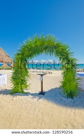 Fragment of the wedding set at the tropical beach. Decoration at the beach wedding venue