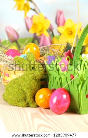  Easter eggs and tulips on wooden planks .German text Happy Easter. Easter background.
