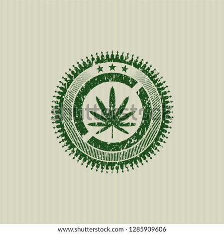 Green weed leaf icon inside distress grunge stamp