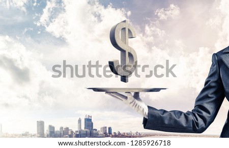 Cropped image of waiter's hand in glove presenting stone dollar symbol on metal tray with cityscape view on background. 3D rendering.