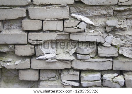 white brick collapsing wall