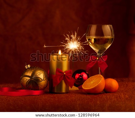  Christmas decoration glass with champagne and burning candles sparkler
