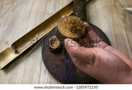 Lemang is a traditional malay food serving during Eid celebration. Lemang made of glutinous rice cooked inside a bamboo. Famous food in Malaysia.Soft, Blurry and contain noise.