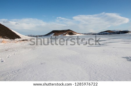 Frozen, icy Myvatn lake and pseudo craters. Winter landscape. Iceland.