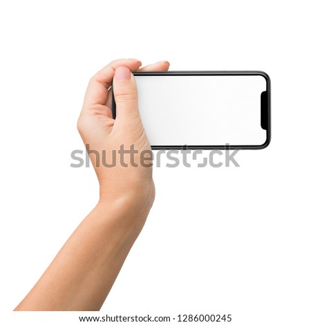 Hand holding mobile phone in horizontal position for mockup, shooting video, isolated on white background