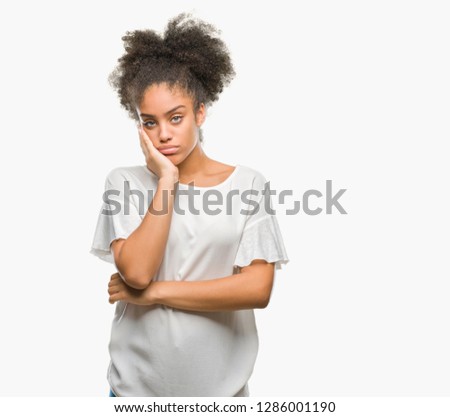 Young afro american woman over isolated background thinking looking tired and bored with depression problems with crossed arms.