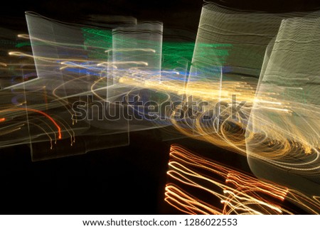 Abstract futuristic background color texture with lighting effect. Modern dynamic shiny pattern. Fractal graphic artwork design. Creative long exposure photography. Abstract lights at night