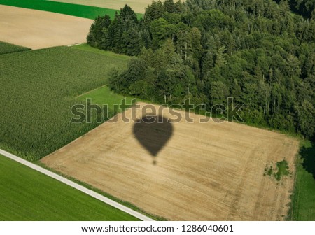 hot air balloon, aerial view, forest Royalty-Free Stock Photo #1286040601