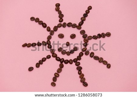 Coffee beans isolated on white background top view with smile face  or sun.