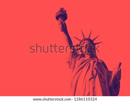 Bottom view of the famous Statue of Liberty, icon of freedom and of the United States. Red duotone effect Royalty-Free Stock Photo #1286110324