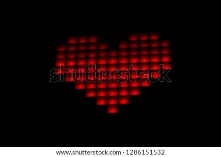 Heart closeup on a black background. Valentine's Day.