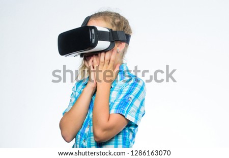 Get virtual experience. Virtual reality concept. Girl cute child with head mounted display on white background. Small kid use modern technology virtual reality. Virtual education for school pupil.