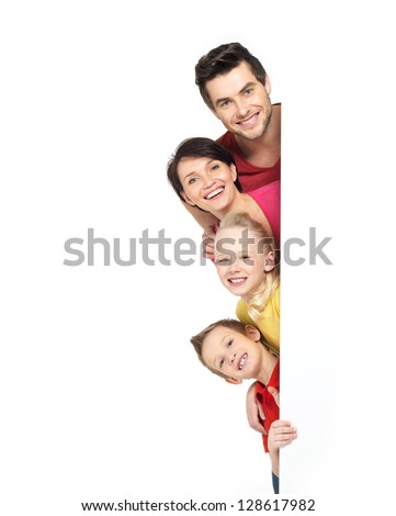 Family with a banner smiling - isolated on a white background