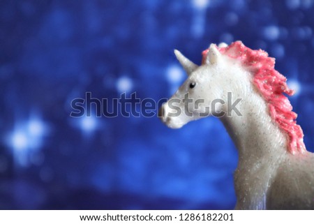 fabulous unicorn on a blue star background