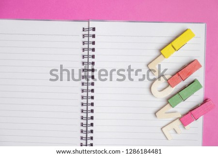 word LOVE in blank book on pink background with space for text, Love icon, valentine's day, relationships concept