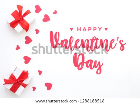 Valentines and womans day, 8 march, red hearts and gifts box in holiday wrapper. Present box of gift on white wooden table top view with copy space, empty space for design.