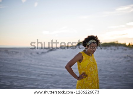 Young woman in vintage dress on the beach