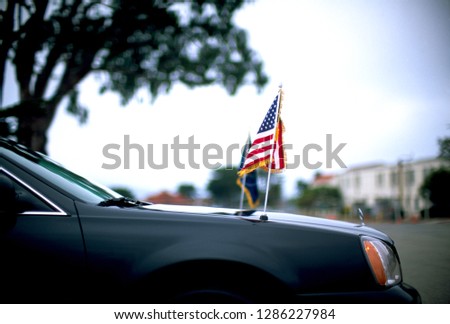 Mercedes with American flag attached