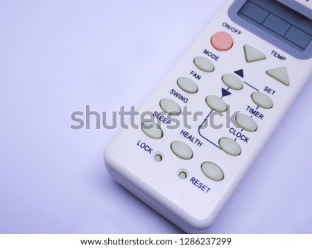 Simple and small air condition remote control isolated on white background. 