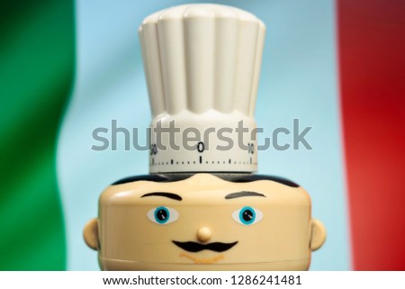 Italian restaurant symbol. Kitchen clock. Chef with torque and mustache with flag of Italy in background. Food delivery. Restaurant serving pizza and other menu specialties. Italian cooking - Image