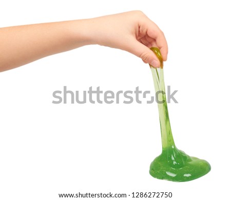 kid playing green slime with hand, transparent toy Royalty-Free Stock Photo #1286272750
