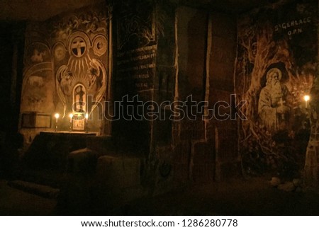 Wall-painting in cave with candles in Valkenburg, the Netherlands Royalty-Free Stock Photo #1286280778
