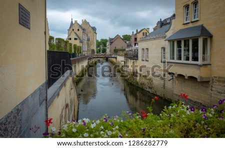 Street in medieval town of Valkenburg, The Netherlands during a cloudy day in summer Royalty-Free Stock Photo #1286282779