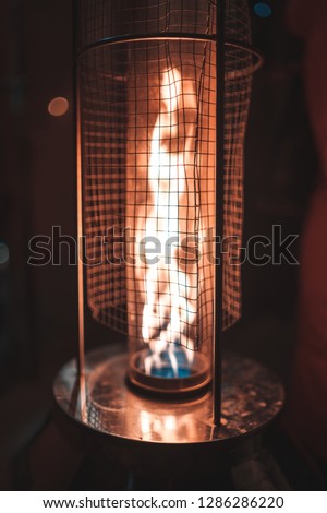 Picture of metal gas heater at the street during night, Gdansk