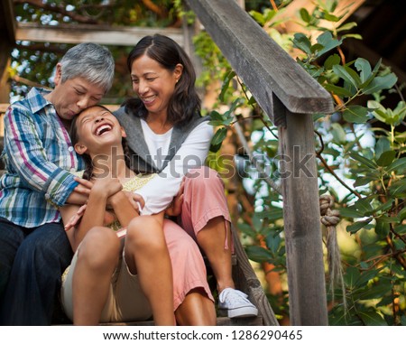 Smiling multi generational family sitting together. Royalty-Free Stock Photo #1286290465